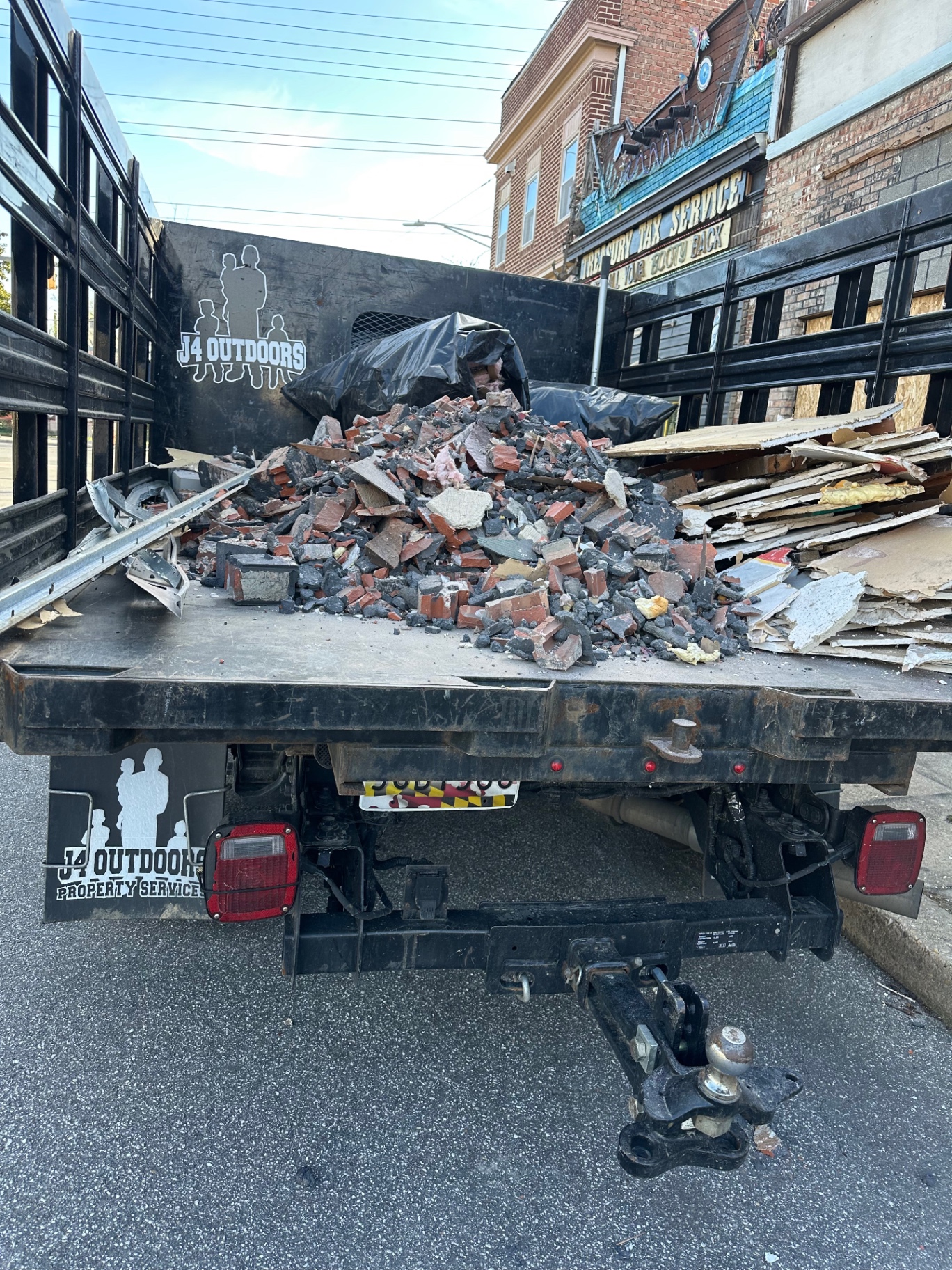 J4 Outdoors hauling construction debris