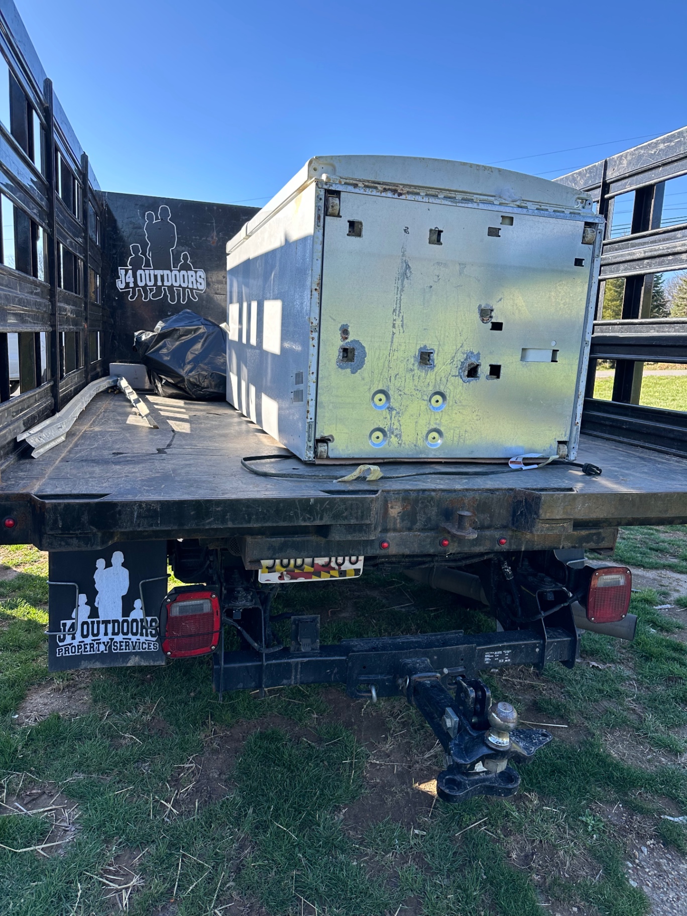J4 Outdoors truck hauling appliance removal